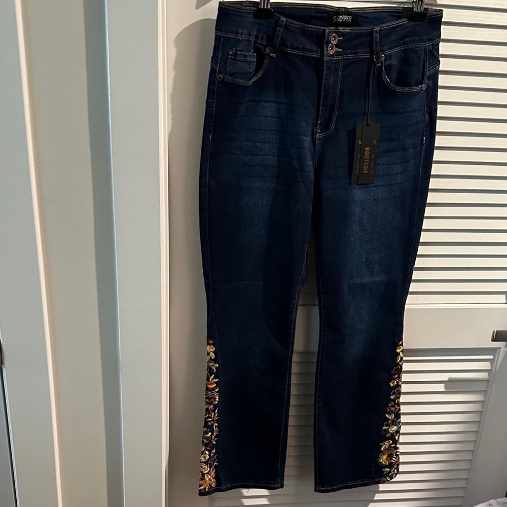 NWT Sandpiper Premium Bootcut Denim with Embroidered Legs and Five Pockets.
